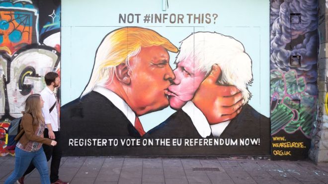 Political art: street art of Trump kissing Boris Johnson