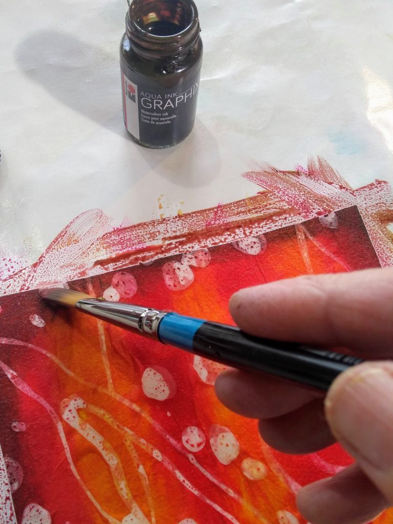 adding ink for batik painting