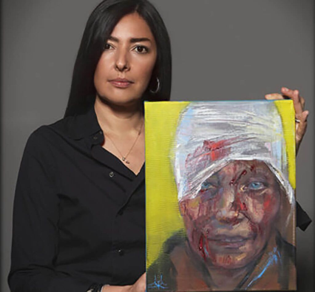 Artist Zhenya Gershman with her painting, First Face of War. Sold to benefit the Ukrainian Red Cross Society.